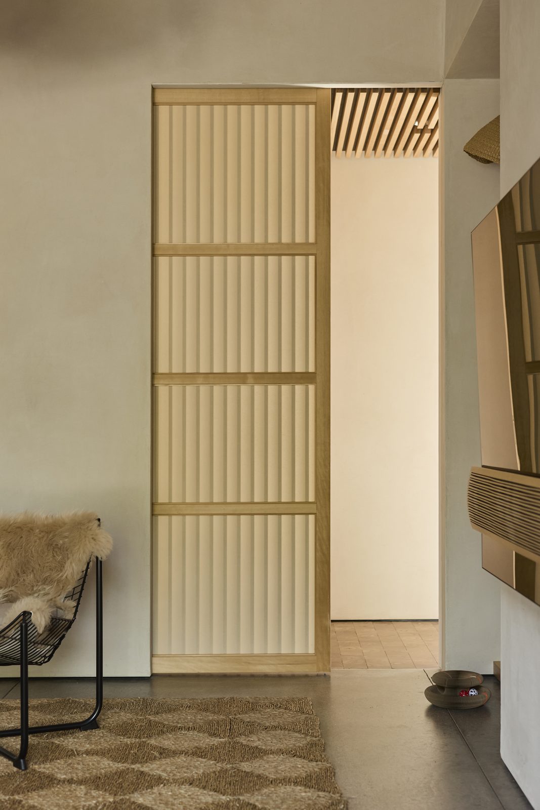 Shoji sliding door set into a plastered wall